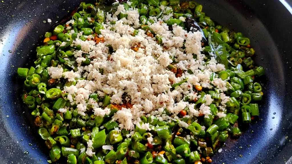 Green beans poriyal: add coconut and green chilies